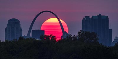 Sun setting behind St Louis